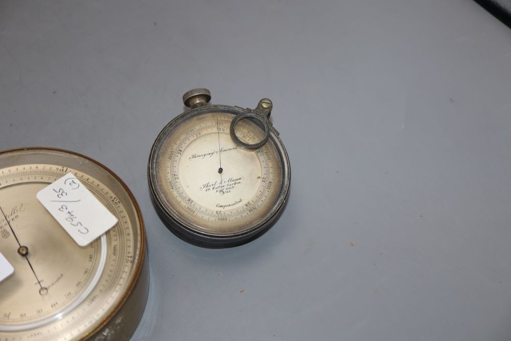 A Short & Mason surveying aneroid precision barometer and a P. Casartelli aneroid barometer, diameter 8cm & 12cm